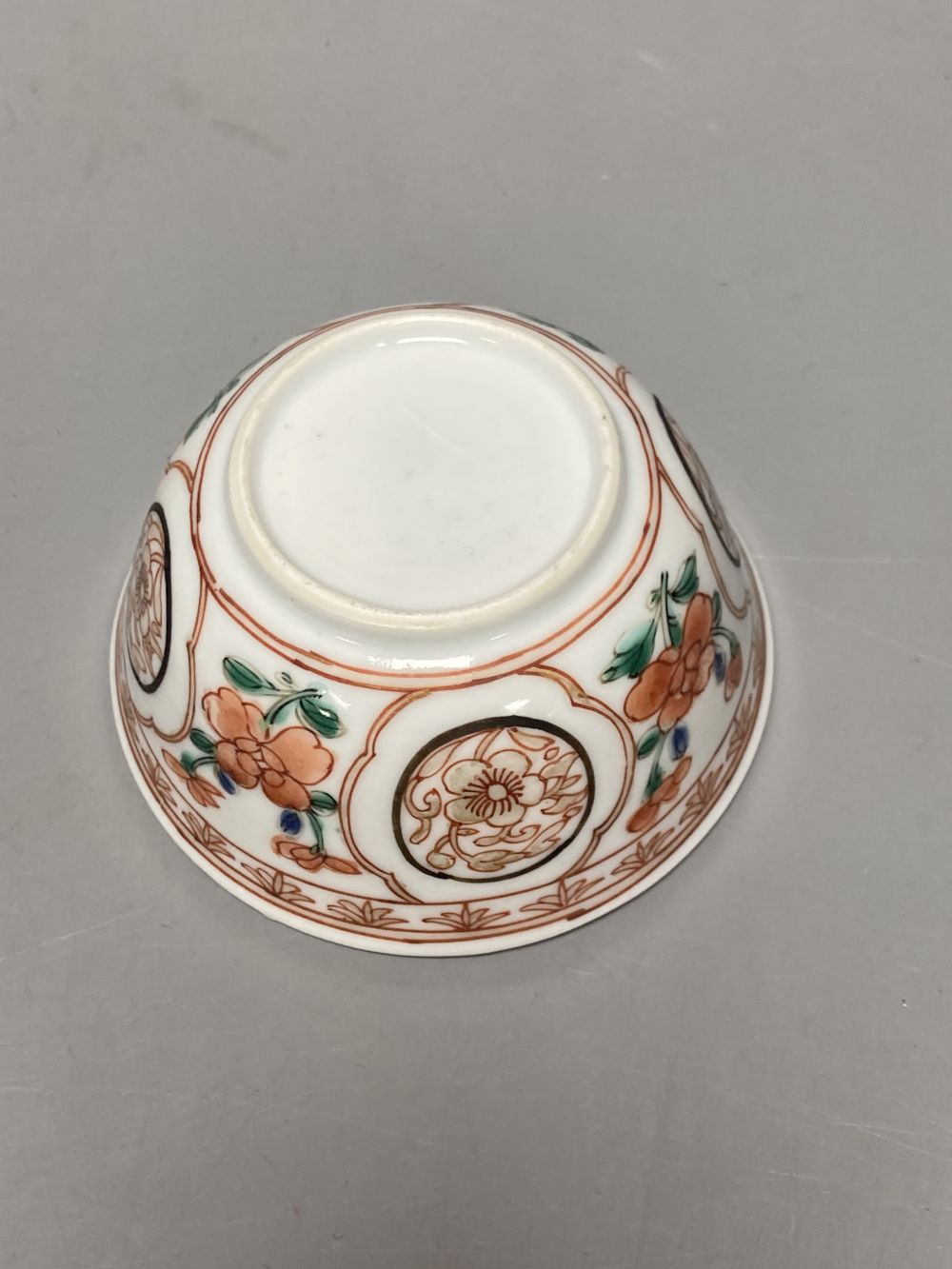 An 18th century Chinese famille rose bowl, 11.5cm diameter, and three smaller Chinese porcelain bowls